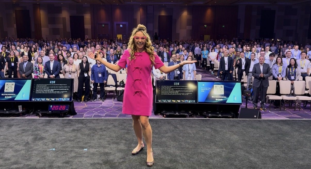Tech keynote speaker Katie Linendoll on stage in front of a packed audience